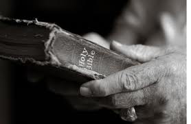 holding bible